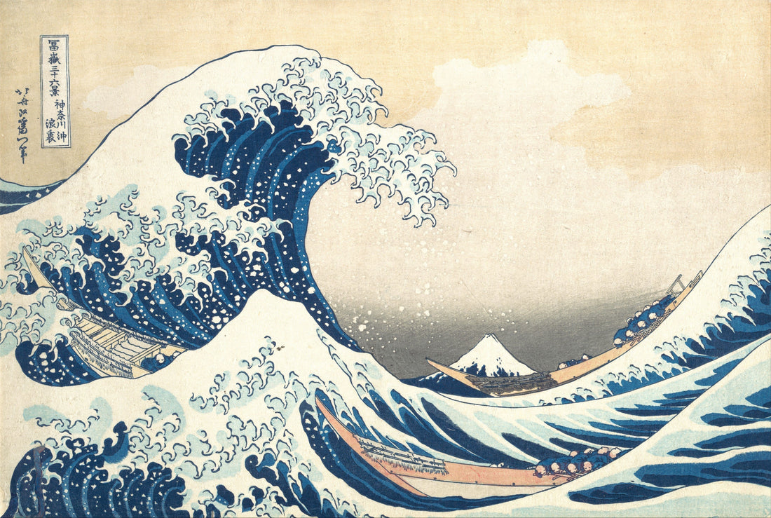 A picture of Hokusai's The Great Wave. The wave is a print on woodblock and shows a huge wave, a tiny boat full of people and Mount Fuji in the distance. The colours are sandstorm for the sky, with prussian blue, indigo and white for the wave.